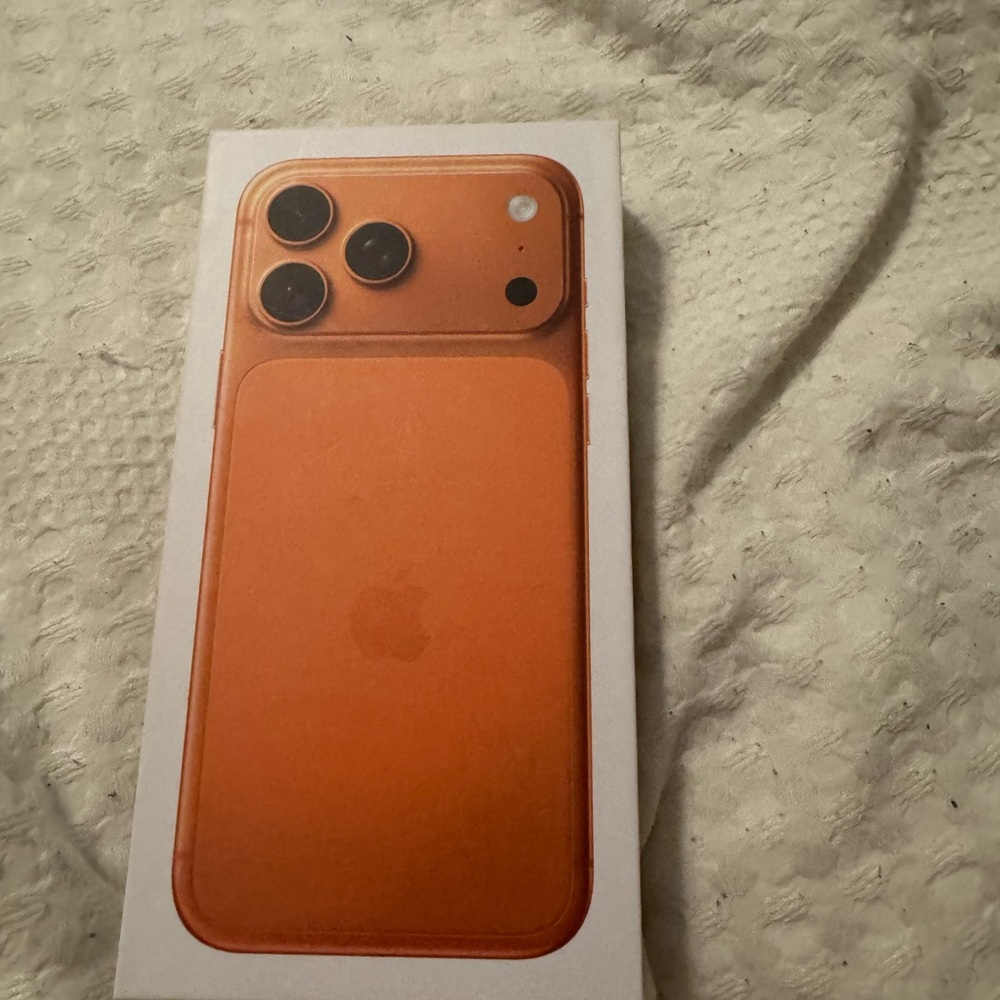 Apple iPhone in Orange
States on the box requires ESIM